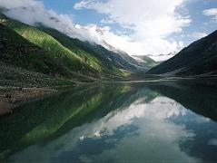 13 Lake Saiful Maluk With Malika Parbat In Kaghan Valley  Ilys drove 9km from Naran in half an hour up 770m to Lake Saiful Maluk (3200m). The overcast skies slowly parted to reveal this beautiful lake, set in alpine surroundings. The water reflects the surrounding peak of Malika Parbat (5290m). Lake Saiful Maluk (3200m) is the most popular lake in Pakistan ... for middle-class Pakistanis that is. They arrived in jeeps, small buses, and on foot, swarming the lake, and vastly outnumbering the one and only foreigner.